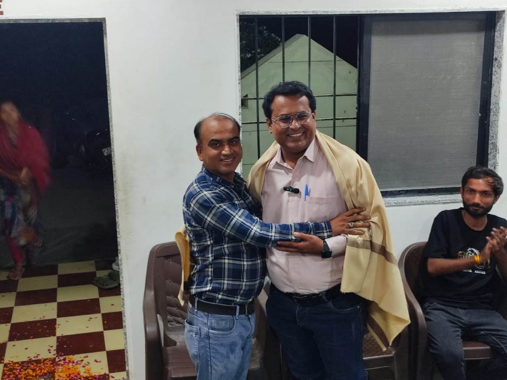 Director Hitesh Sir welcoming and honoring guest speaker with a shawl
