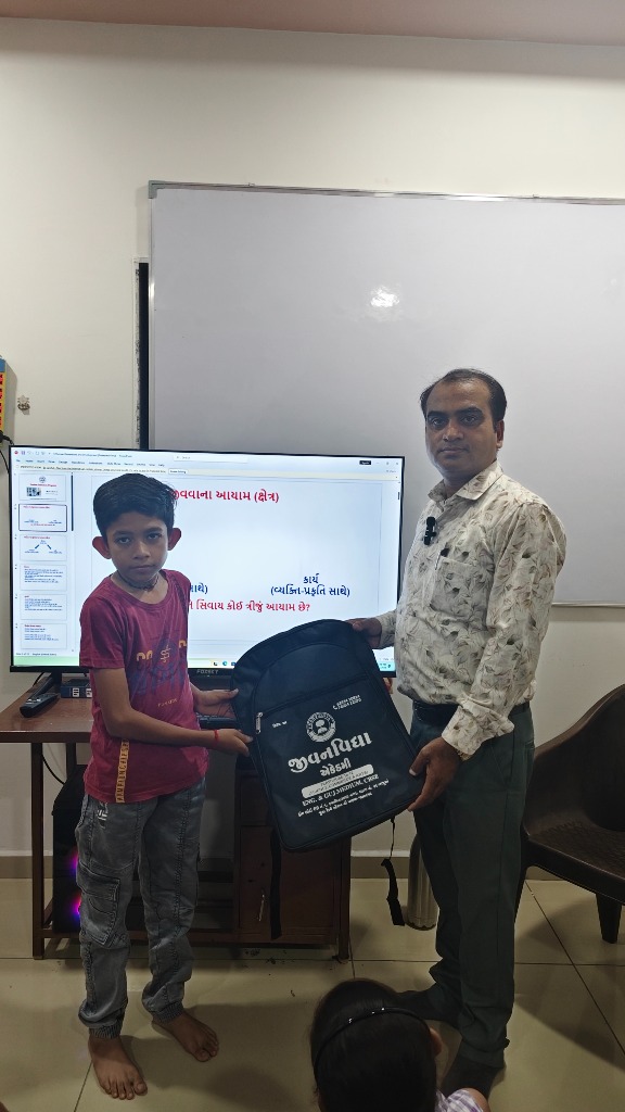 Hitesh Sir distributing Jivanvidhya Academy school bags to students