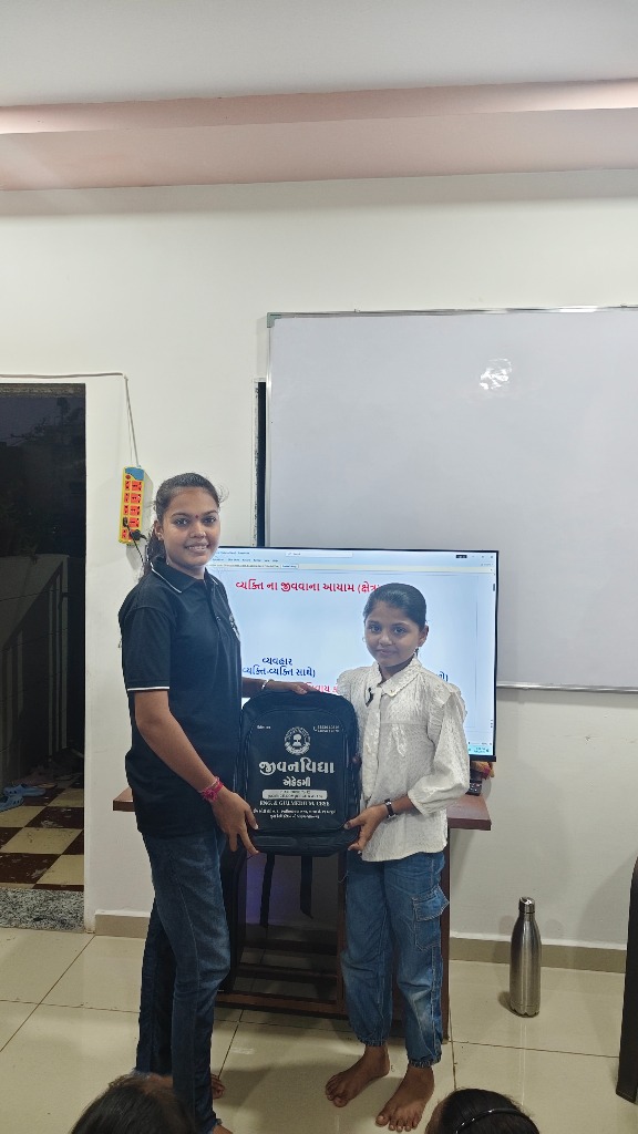 Young student receiving study materials and bag at the academy