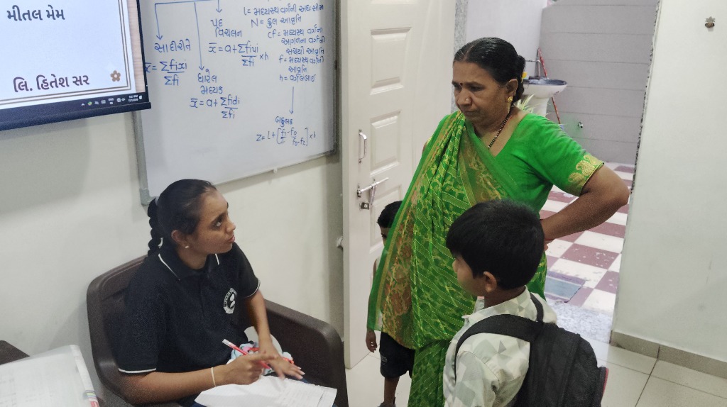 Interactive discussion between parent, student, and Jivanvidhya Academy mentor