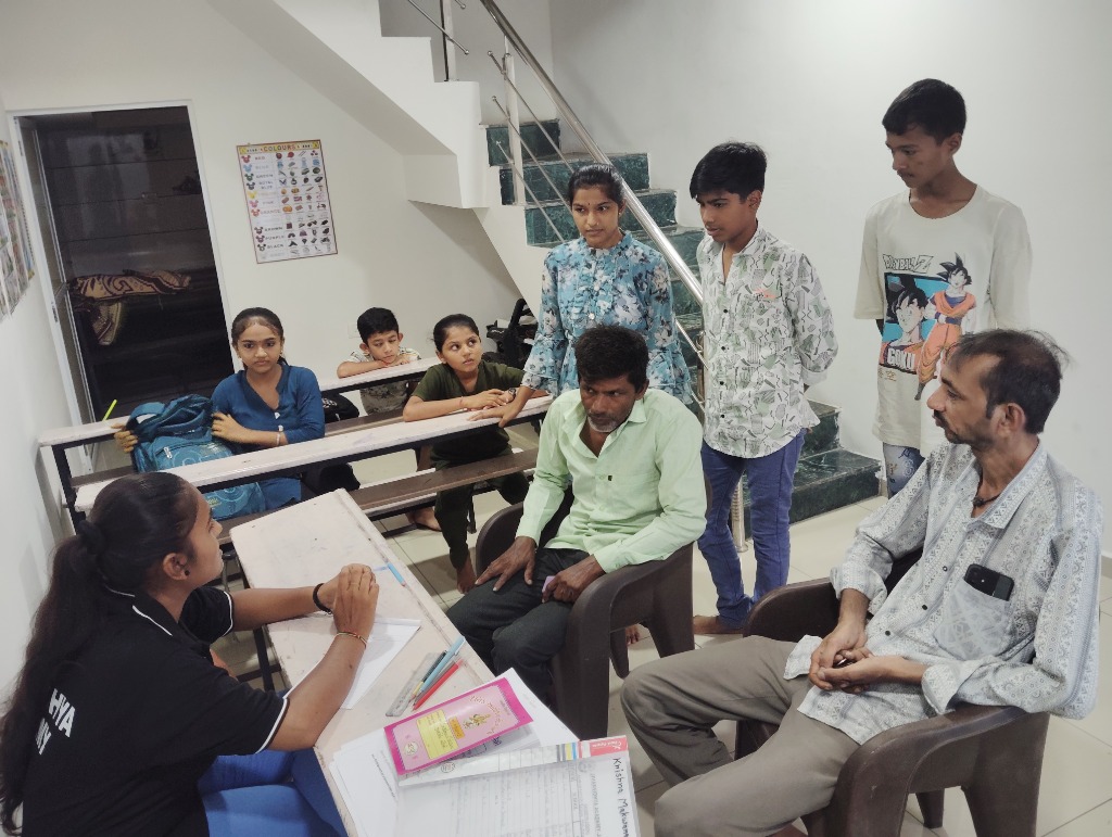Group parent teacher interactive session in classroom space